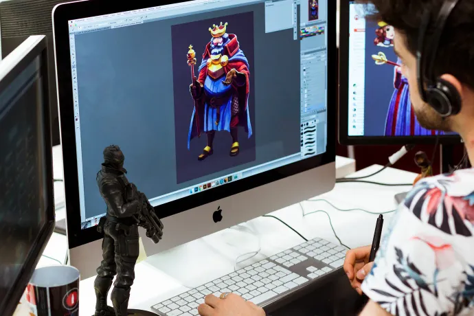 A Tangelo Games artist designing a game character on screen