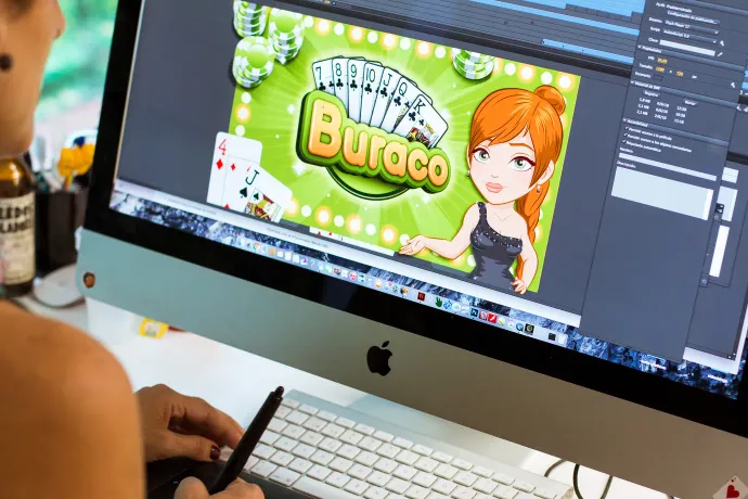 A Tangelo Games designer working on artwork for the game Buraco
