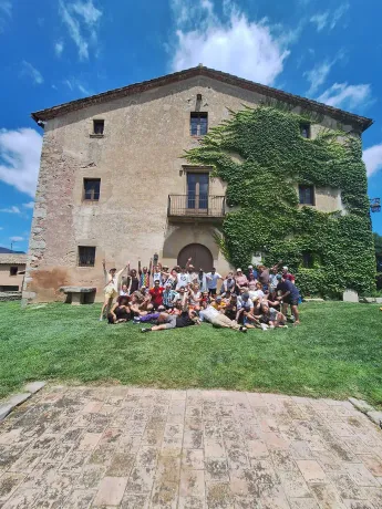 The Tangelo Games team in front of the stone farmhouse hosting the offsite