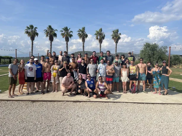 Tangelo Games colleagues gathered outdoors for a team photo