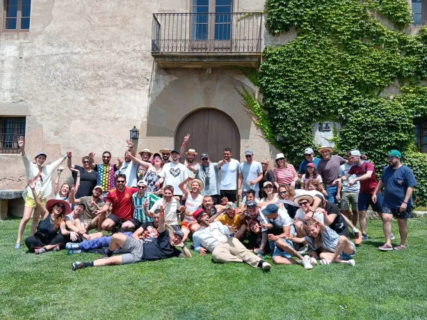 The whole Tangelo Games team together on the grass at a company offsite